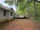 Large backyard featuring a spacious deck, perfect for outdoor entertaining and relaxation at 235 Creekside Way, Mcdonough, GA 30252
