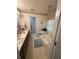 Bathroom featuring a soaking tub, double sinks, and vanity with storage at 235 Creekside Way, Mcdonough, GA 30252