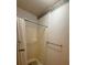 Shower stall with a curtain and tiled floor in a bathroom with neutral colored walls at 235 Creekside Way, Mcdonough, GA 30252