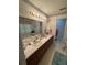Bathroom featuring a soaking tub, double sinks, and vanity with storage at 235 Creekside Way, Mcdonough, GA 30252