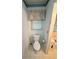 Cozy half-bathroom showcasing a toilet, and a window offering views to the garden at 235 Creekside Way, Mcdonough, GA 30252