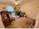 Bedroom with neutral paint, carpet, and a ceiling fan at 235 Creekside Way, Mcdonough, GA 30252