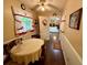 Charming breakfast nook with hardwood floors, ceiling fan and views to the backyard at 235 Creekside Way, Mcdonough, GA 30252