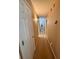 Hallway with neutral paint, carpet, and multiple doorways at 235 Creekside Way, Mcdonough, GA 30252