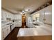 Bright kitchen features white cabinetry, tiled backsplash, and updated countertops at 235 Creekside Way, Mcdonough, GA 30252