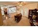 Inviting living room with ceiling fan, French doors, and built-in shelving unit at 235 Creekside Way, Mcdonough, GA 30252