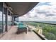Relaxing balcony with comfortable seating and open views of city and nature at 3344 Peachtree Rd # 3505, Atlanta, GA 30326