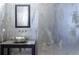 Sleek bathroom features a stainless steel sink, textured wall, and modern hardware at 3344 Peachtree Rd # 3505, Atlanta, GA 30326