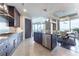 Modern kitchen with stainless steel appliances and a dining area with city views at 3344 Peachtree Rd # 3505, Atlanta, GA 30326