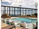 Modern, luxurious pool with lounge chairs and downtown view at 3344 Peachtree Rd # 3505, Atlanta, GA 30326
