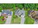 Aerial view of a well-manicured suburban home with a lush front lawn at 4170 Haynes Mill Nw Ct, Kennesaw, GA 30144