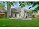Home's beautiful backyard features a well-maintained lawn and patio area at 4170 Haynes Mill Nw Ct, Kennesaw, GA 30144