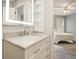 Bathroom with new vanity and lit mirror, visible from the bedroom at 4170 Haynes Mill Nw Ct, Kennesaw, GA 30144