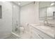 Bathroom with a glass shower door, marbled tile, and a white sink vanity at 4170 Haynes Mill Nw Ct, Kennesaw, GA 30144