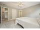 Bedroom with neutral walls, ceiling fan, and carpet at 4170 Haynes Mill Nw Ct, Kennesaw, GA 30144