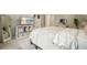 Bedroom with a large TV, mirror, and neutral walls and carpet at 4170 Haynes Mill Nw Ct, Kennesaw, GA 30144