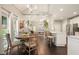 Sunlit dining area features a round table and kitchen view at 4170 Haynes Mill Nw Ct, Kennesaw, GA 30144