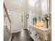 Bright foyer with hardwood floors, a white staircase, and a decorative console table at 4170 Haynes Mill Nw Ct, Kennesaw, GA 30144