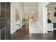 Spacious foyer with hardwood floors, a staircase, and stylish decor at 4170 Haynes Mill Nw Ct, Kennesaw, GA 30144