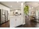 Open kitchen boasts stainless appliances, an island and flows into the dining room at 4170 Haynes Mill Nw Ct, Kennesaw, GA 30144