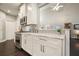Modern kitchen with white cabinets, marble countertops, and stainless appliances at 4170 Haynes Mill Nw Ct, Kennesaw, GA 30144