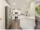 Modern kitchen featuring stainless appliances, white cabinets and bar seating at 4170 Haynes Mill Nw Ct, Kennesaw, GA 30144