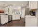 Bright kitchen featuring white cabinets, stainless appliances and marble counters at 4170 Haynes Mill Nw Ct, Kennesaw, GA 30144