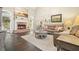 Bright living room with a brick fireplace, tall ceilings, and comfortable seating at 4170 Haynes Mill Nw Ct, Kennesaw, GA 30144