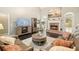 Inviting living room featuring a cozy fireplace and neutral decor at 4170 Haynes Mill Nw Ct, Kennesaw, GA 30144