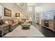 Spacious living room with hardwood floors, comfortable seating, and a large area rug at 4170 Haynes Mill Nw Ct, Kennesaw, GA 30144
