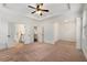 Large main bedroom with tray ceiling and a doorway to the bathroom at 6995 Tybridge St, Cumming, GA 30040