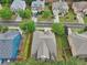 Property overview showcasing roof, landscaping, and nearby houses in suburban neighborhood setting at 2760 Lions Gate Dr, Cumming, GA 30041
