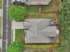 Aerial view of a home's roof, driveway, and surrounding yard, including the sidewalk at 2760 Lions Gate Dr, Cumming, GA 30041