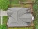 Bird's eye view of a home with a well-maintained roof, clean driveway, and lush landscaping at 2760 Lions Gate Dr, Cumming, GA 30041