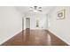 Large bedroom showing hardwood floors, lots of light, and access to the bathroom and closet at 2760 Lions Gate Dr, Cumming, GA 30041