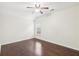 Bedroom with hardwood floors, a ceiling fan, and a window with great natural light at 2760 Lions Gate Dr, Cumming, GA 30041