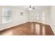 Spacious bedroom featuring hardwood floors, a ceiling fan, and lots of natural light at 2760 Lions Gate Dr, Cumming, GA 30041