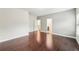 Neutral colored bedroom with hardwood floors, windows, and multiple doorways at 2760 Lions Gate Dr, Cumming, GA 30041
