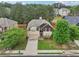 Charming two-story home with manicured lawn and mature trees providing shade at 2760 Lions Gate Dr, Cumming, GA 30041