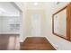 Bright foyer with hardwood floors, high ceilings, and a decorative mirror at 2760 Lions Gate Dr, Cumming, GA 30041