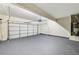 Spacious two car garage with painted floor and garage door opener at 2760 Lions Gate Dr, Cumming, GA 30041
