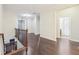 Upstairs hallway with views of the stairs and multiple doorways at 2760 Lions Gate Dr, Cumming, GA 30041