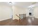 Hallway featuring beautiful wood floors and views into the living room at 2760 Lions Gate Dr, Cumming, GA 30041