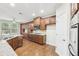 Gourmet kitchen boasts hardwood floors, granite counters, stainless appliances, and ample cabinetry at 2760 Lions Gate Dr, Cumming, GA 30041