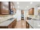 Bright kitchen features granite countertops, stainless steel appliances, and hardwood floors at 2760 Lions Gate Dr, Cumming, GA 30041