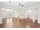 Spacious living room with hardwood floors, columns, and bright natural light at 2760 Lions Gate Dr, Cumming, GA 30041