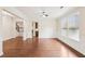 Open-concept living room with hardwood floors and crown molding at 2760 Lions Gate Dr, Cumming, GA 30041