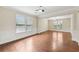 Bright, open-concept living area with hardwood floors and neutral paint at 2760 Lions Gate Dr, Cumming, GA 30041