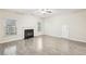Living room with light wood floors, fireplace, ceiling fan, and natural light at 2760 Lions Gate Dr, Cumming, GA 30041