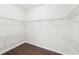 Walk-in closet with wood flooring and plenty of shelving for optimal storage at 2760 Lions Gate Dr, Cumming, GA 30041